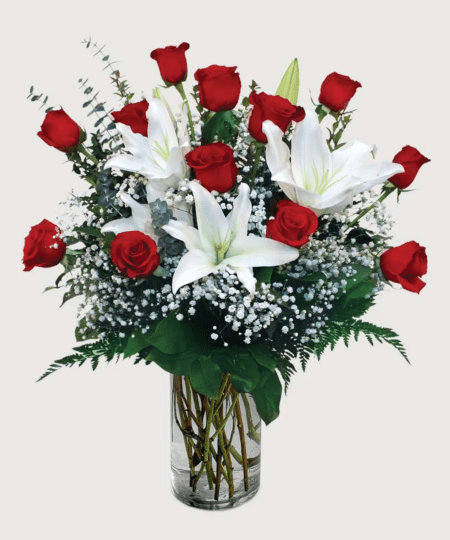 A dozen roses are complimented by the beauty and sweet scent of fragrant white lilies. Make an impression with this gorgeous and naturally sweet-scented arrangement. We offer same-day flower delivery to our local customers in Everett, Lynnwood, Seattle, WA or nationwide.