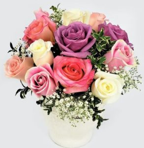 Antique hues of Lavender, pink and cream Roses mixed with seasonal cut garden accents